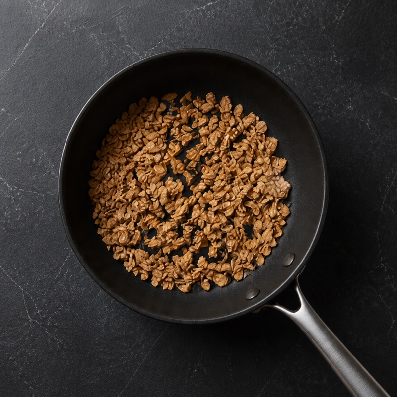 Step 2: Toast the oats dry in a pan, 2 minutes.