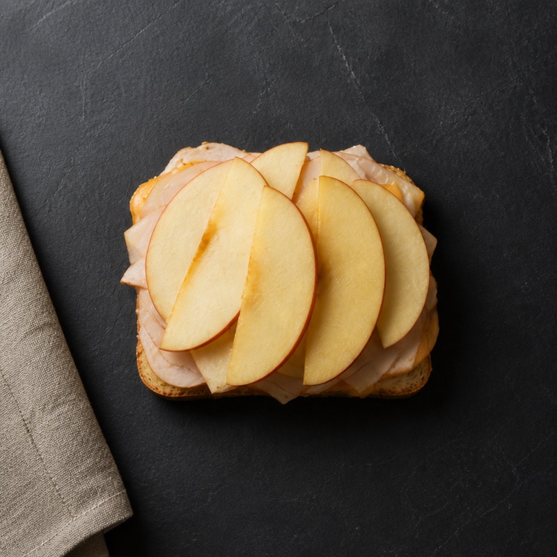 Step 2: Layer turkey, cheese and thin apple slices.